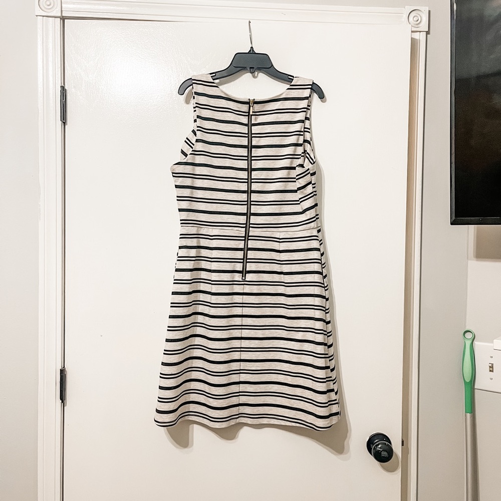 Maurice’s size large dress. Light greige with black stripes and a gold zipper.